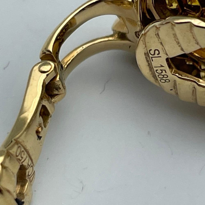 A diamond and gold pair of earrings by VAN CLEEF & ARPELS