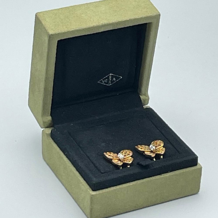 A diamond and gold pair of earrings by VAN CLEEF & ARPELS